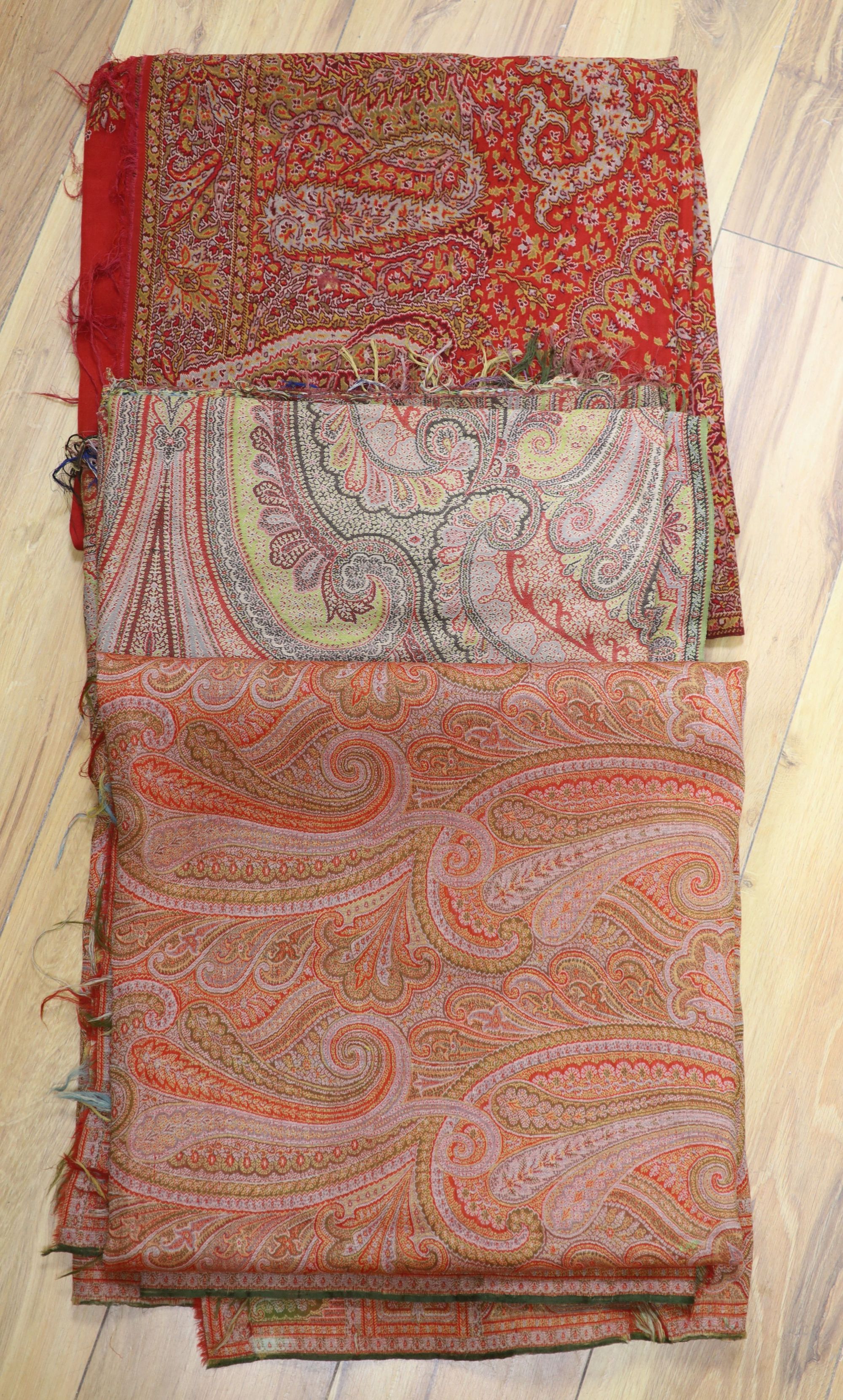 A 19th century Paisley shawl and two part Paisley shawls